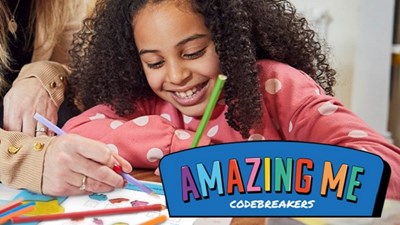 Smiling girl using activity book